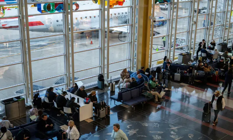 Travellers wait for their flights at Ronald Reagan Washington National Airport, more than a month into the ongoing US government shutdown, in Arlington, Virginia, U.S., November 9, 2025//REUTERS