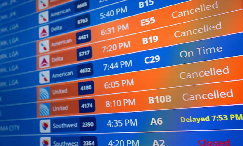 Flight timings and cancellations are displayed on the departures board at Ronald Reagan Washington National Airport in Arlington, Virginia. – Reuters