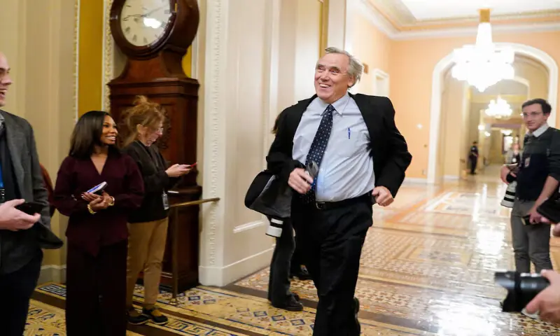 US Senator Jeff Merkley jogs through a hallway during a vote related to government funding on Capitol Hill in Washington. – Reuters