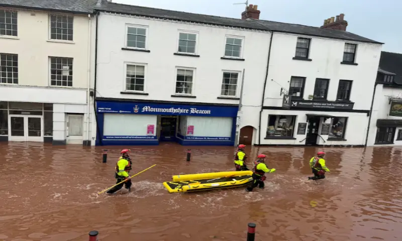 Rescue workers wade through floodwater after severe flooding in south Wales, as Storm Claudia reaches parts of the United Kingdom, in Monmouth, Wales, on November 15, 2025, in this picture obtained from social media. Reuters Rescue workers wade through floodwater after severe flooding in south Wales, as Storm Claudia reaches parts of the United Kingdom, in Monmouth, Wales, on November 15, 2025, in this picture obtained from social media. Reuters