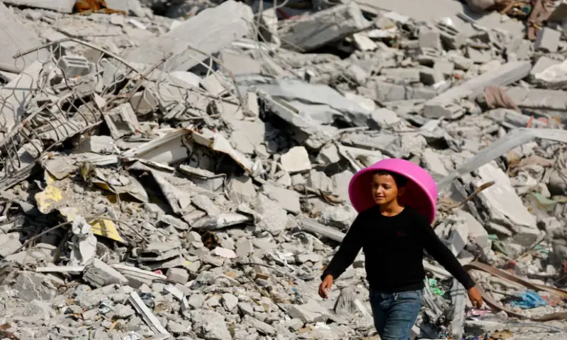 A Palestinian youth walks past the rubble of destroyed buildings, amid a ceasefire between Israel and Hamas, in Gaza City, on November 2, 2025. Reuters file A Palestinian youth walks past the rubble of destroyed buildings, amid a ceasefire between Israel and Hamas, in Gaza City, on November 2, 2025. Reuters file