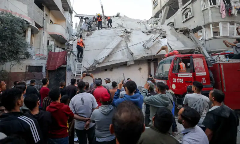 Palestinians inspect the site of an Israeli strike in Gaza City on November 22, 2025. Reuters