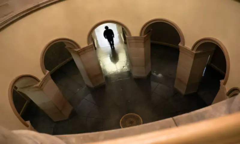 A worker walks through a hallway at the U.S. Capitol in the hours before a partial government shutdown in Washington, D.C., US, September 30, 2025//REUTERS