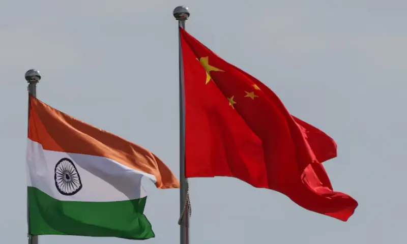 National flags of China and India fly next to the Meijiang Convention and Exhibition Centre, a venue for the 2025 Shanghai Cooperation Organisation (SCO) summit in Tianjin, China, August 30, 2025//REUTERS