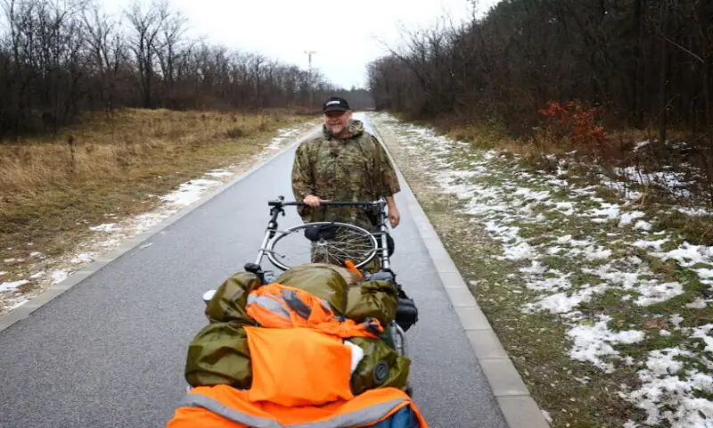 British ex-paratrooper Karl Bushby who has been walking across the world for 27 years, smiles during his trip in Komarom, Hungary, on November 25, 2025. Reuters