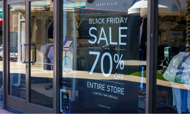 A Black Friday sale sign is displayed in a shop window at an outlet mall in Carlsbad, California, on November 25, 2025. Reuters