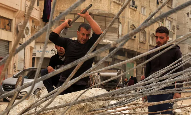 Palestinian workers break concrete to extract steel bars from destroyed homes, relying only on simple hand tools amid a severe shortage of construction materials caused by long-standing restrictions on the entry of cement and iron, in Khan Younis in the southern Gaza Strip, December 9, 2025. REUTERS Palestinian workers break concrete to extract steel bars from destroyed homes, relying only on simple hand tools amid a severe shortage of construction materials caused by long-standing restrictions on the entry of cement and iron, in Khan Younis in the southern Gaza Strip, December 9, 2025. REUTERS