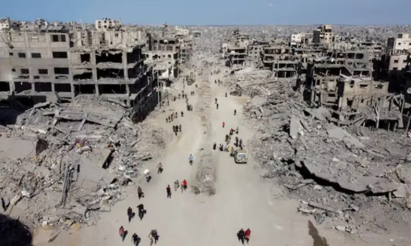 A drone view shows Palestinians walking past the rubble, following Israeli forces’ withdrawal from the area, amid a ceasefire between Israel and Hamas in Gaza, in Gaza City, on October 11, 2025. Reuters file A drone view shows Palestinians walking past the rubble, following Israeli forces’ withdrawal from the area, amid a ceasefire between Israel and Hamas in Gaza, in Gaza City, on October 11, 2025. Reuters file