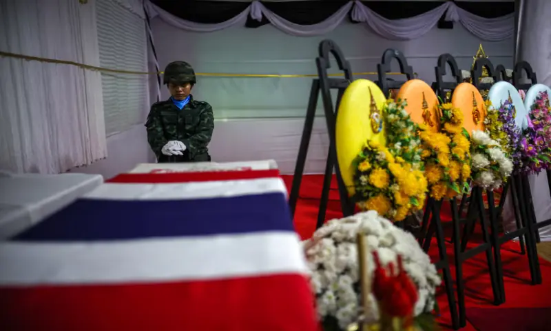 A soldier salutes next to a coffin of Sergeant Major Ananda Udon, 39, a Thai soldier who died on December 10 amid clashes between Thailand and Cambodia along a disputed border area, during his funeral at a temple in Si Sa Ket province, Thailand, December 12, 2025. —Reuters A soldier salutes next to a coffin of Sergeant Major Ananda Udon, 39, a Thai soldier who died on December 10 amid clashes between Thailand and Cambodia along a disputed border area, during his funeral at a temple in Si Sa Ket province, Thailand, December 12, 2025. —Reuters