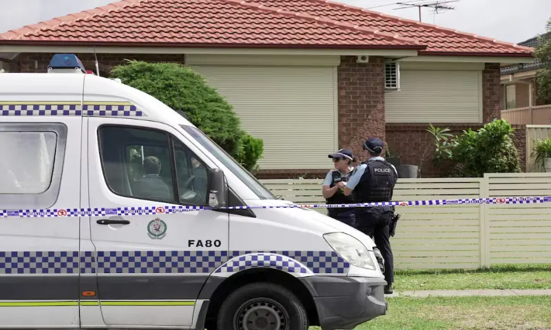 Police officers stand guard outside the house of the suspects of a shooting incident at Bondi Beach, in Bonnyrigg, Sydney, Australia, on Sunday. – Reuters Police officers stand guard outside the house of the suspects of a shooting incident at Bondi Beach, in Bonnyrigg, Sydney, Australia, on Sunday. – Reuters