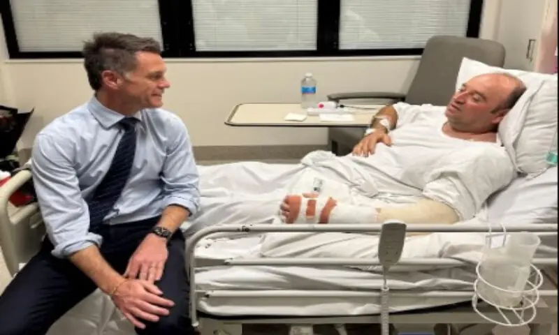 New South Wales Premier Chris Minns visits Ahmed al Ahmed, who was identified on social media as the bystander who hid behind parked cars and seized a rifle from one of the gunmen during the deadly shooting at Bondi Beach on Sunday, at a hospital in Sydney, Australia, on December 15, 2025, in this picture obtained from social media. @ChrisMinnsMP via X/via Reuters New South Wales Premier Chris Minns visits Ahmed al Ahmed, who was identified on social media as the bystander who hid behind parked cars and seized a rifle from one of the gunmen during the deadly shooting at Bondi Beach on Sunday, at a hospital in Sydney, Australia, on December 15, 2025, in this picture obtained from social media. @ChrisMinnsMP via X/via Reuters