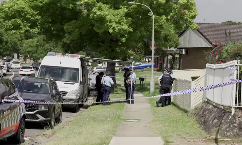 Police officers stand guard outside the house of the suspects of a shooting incident at Bondi Beach in Bonnyrigg, Sydney, Australia. – Reuters Police officers stand guard outside the house of the suspects of a shooting incident at Bondi Beach in Bonnyrigg, Sydney, Australia. – Reuters