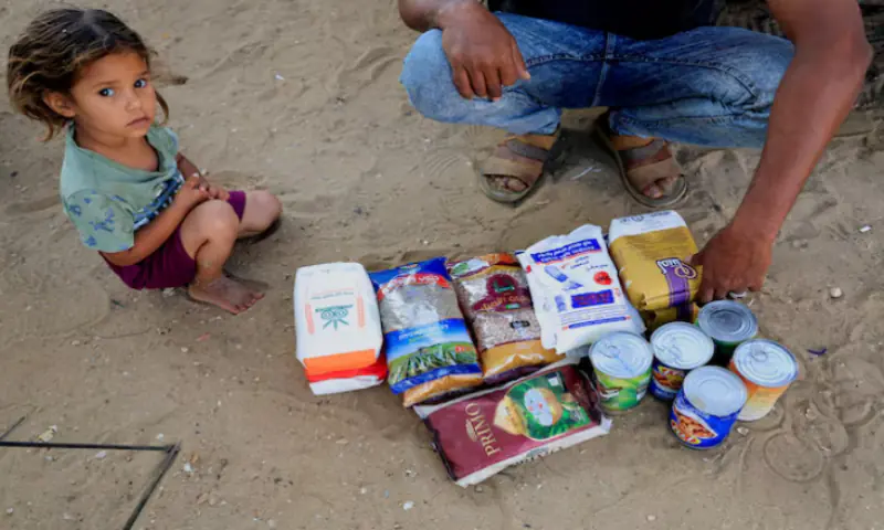 A Palestinian man displays the aid supplies from the US-supported Gaza Relief Organisation, in Khan Younis. – Reuters A Palestinian man displays the aid supplies from the US-supported Gaza Relief Organisation, in Khan Younis. – Reuters