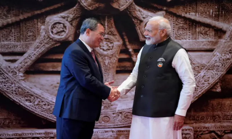 Indian Prime Minister Narendra Modi shakes hands with Chinese Premier Li Qiang upon his arrival at Bharat Mandapam convention centre for the G20 Summit in New Delhi, India. &ndash; Reuters