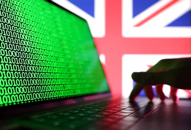 Illustration shows a laptop with binary codes displayed in front of the UK flag in this illustration taken. &ndash; Reuters file