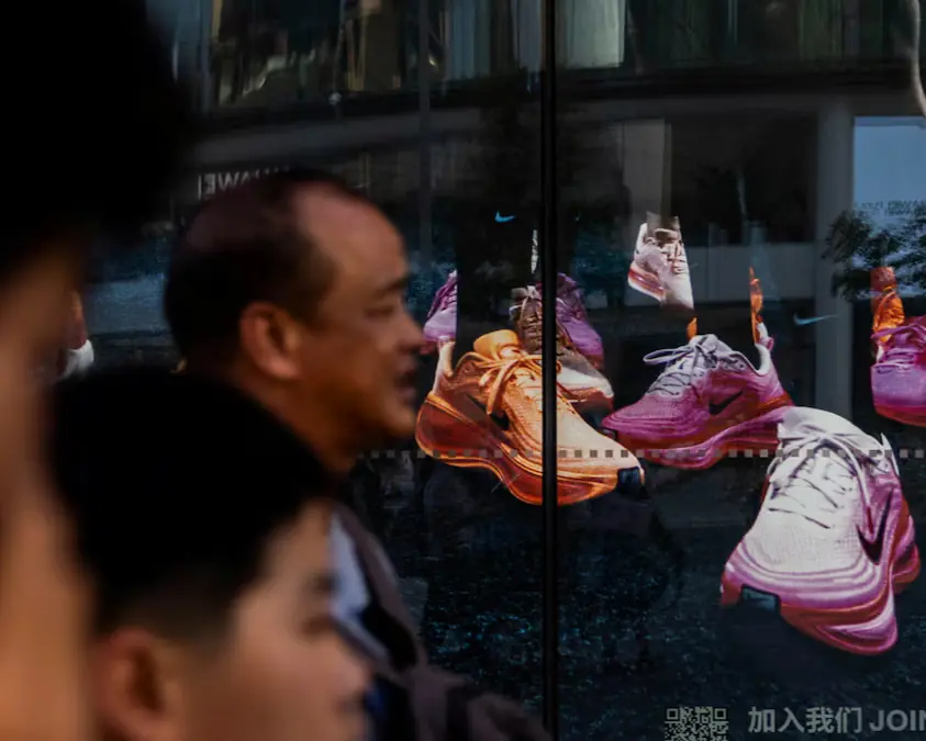 People walk past a showcase of a Nike store on Wangfujing Street in Beijing, China. &ndash; Reuters file