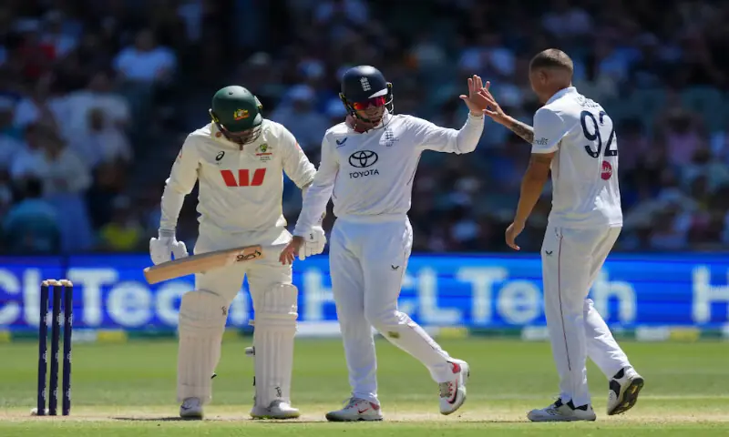 England&rsquo;s Brydon Carse celebrates with a teammate after taking the wicket of Australia&rsquo;s Nathan Lyon
during the third Ashes Test at Adelaide Oval, Adelaide. &ndash; Reuters