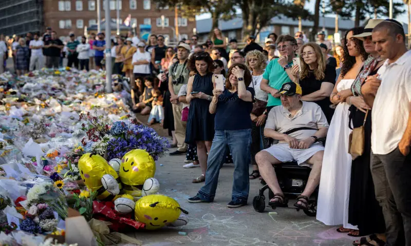 People gather to honour the victims of a mass shooting in Sydney, Australia. &ndash; Reuters