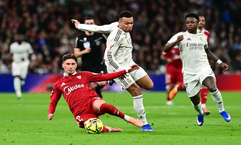 Sevilla&rsquo;s Jose Angel Carmona in action with Real Madrid&rsquo;s Kylian Mbappe and Vinicius Junior in Santiago Bernabeu, Madrid, Spain. &ndash; Reuters