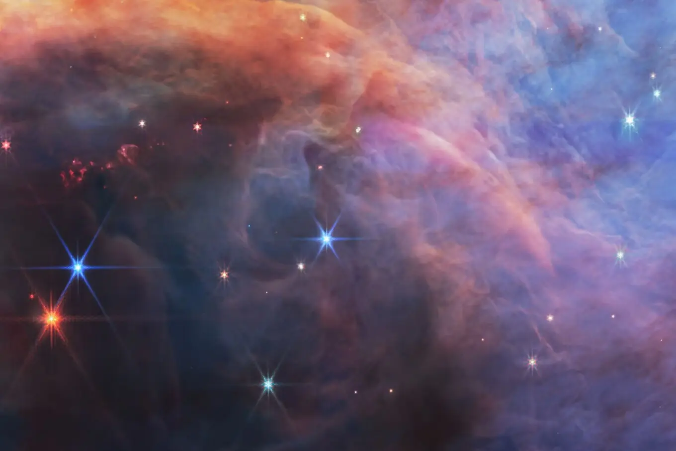 جیمز ویب اسپیس ٹیلی اسکوپ کی یہ تصویر اوریون کے فلیم نیبولا کو دکھاتی ہے، جہاں چھوٹے اور کم روشنی والے براؤن ڈورف ستاروں کی تلاش اور ان کی کم سے کم کمیت کا مطالعہ ممکن ہو رہا ہے۔