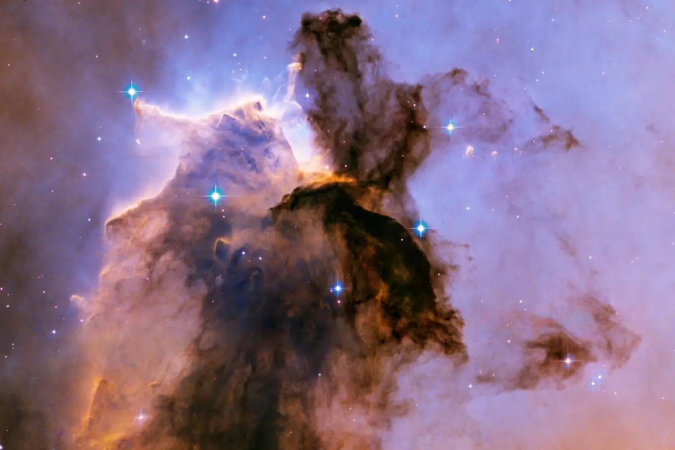 ہبل اسپیس ٹیلی اسکوپ کی یہ نئی تصویر ایگل نیبولا (میسئیر 16) میں سرد گیس اور گرد و غبار کے تقریباً 9.5 نوری سال بلند عظیم ستون کو دکھاتی ہے، جو نوزائیدہ ستاروں کی طاقتور روشنی اور ہواؤں سے تراشے گئے دلکش بادلوں کی ایک شاندار مثال ہے۔