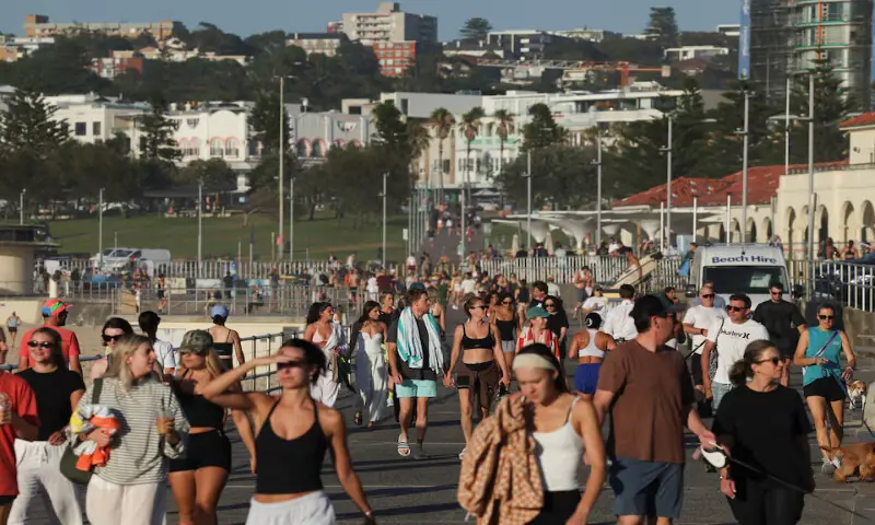 People walk as the crime scene was reopened following the mass shooting at Bondi Beach in Sydney, Australia. &ndash; Reuters