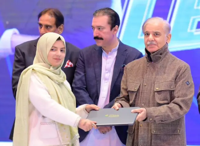 Prime Minister Shehbaz Sharif distributes laptops among students in Muzaffarabad.