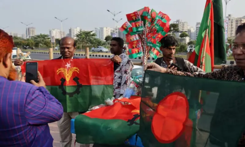 A supporter of the Bangladesh Nationalist Party holds a party&rsquo;s flag ahead of a rally to be attended by BNP acting chairman Tarique Rahman after his return from London, in Dhaka, Bangladesh, on December 23, 2025. Reuters