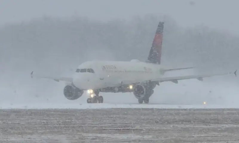 A Delta Air Lines plane prepares to take off during a winter storm at Greater Rochester International Airport in Rochester, New York, U.S., on December 26, 2025, in this screengrab obtained from a social media video. Reuters