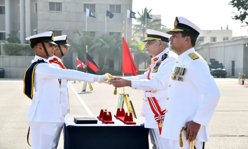Commander Royal Bahrain Naval Force awarding Sword of Honour to Midshipman Muhammad Uzair Abbas during 124th Midshipmen and 32nd SSC course Commissioning Parade at Pakistan Naval Academy, Karachi.