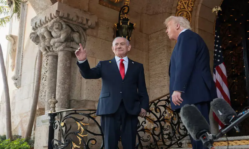 Israeli regime leader Benjamin Netanyahu gestures as he is welcomed by US President Donald Trump for meetings at the Mar-a-Lago club in Palm Beach, Florida, US. &ndash; Reuters