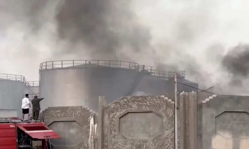 A person gestures towards smoke rising in the aftermath of a Saudi-led coalition airstrike in Yemen&rsquo;s southern port of Mukalla. &ndash; Reuters