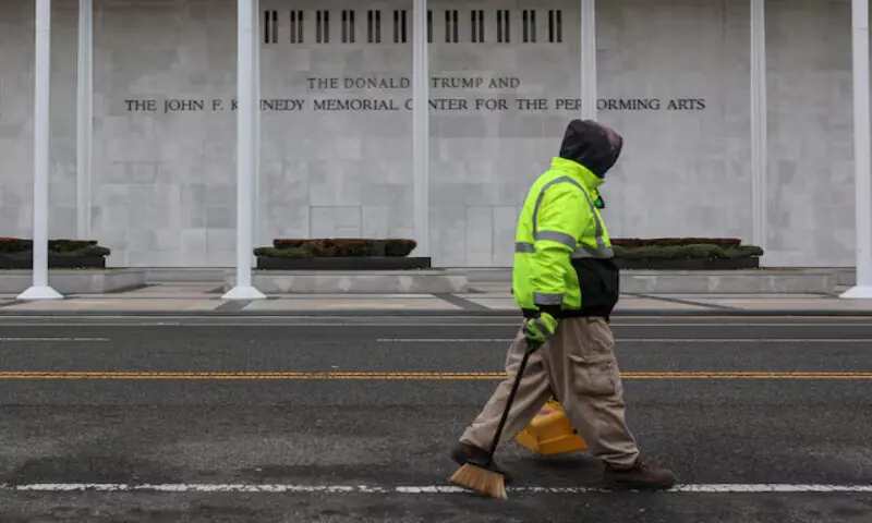 A worker walks in front of the recently renamed Donald J. Trump and John F. Kennedy Memorial Centre for the Performing Arts in Washington. &ndash; Reuters