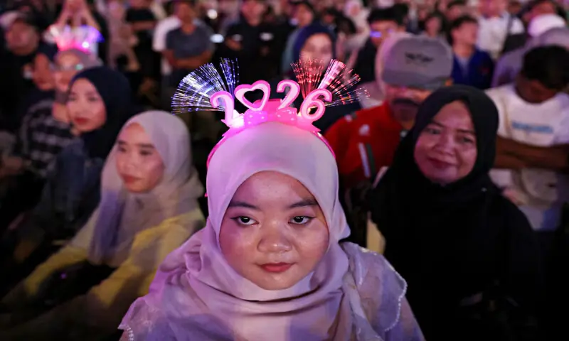 People attend the New Year&rsquo;s Eve celebrations in Jakarta, Indonesia. &ndash; Reuters