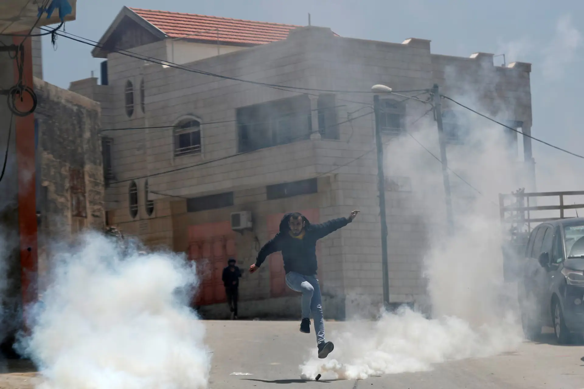 A Palestinian runs away from tear gas fired by Israeli forces during a raid. &ndash; Reuters file