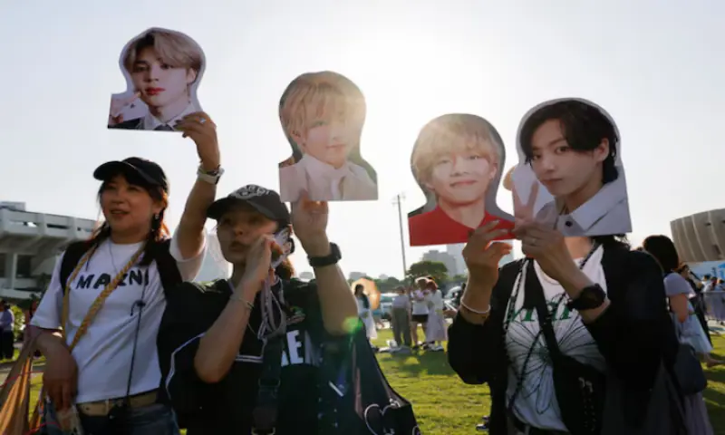Fans holding BTS members&rsquo; portraits attend 2024 FESTA, an event for fans of the K-pop boy band BTS, in Seoul, South Korea. &ndash; Reuters