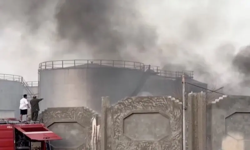 A person gestures towards smoke rising in the aftermath of a Saudi-led coalition airstrike, which targeted southern separatists, in Yemen&rsquo;s southern port of Mukalla, in this screengrab from a handout video obtained by Reuters on December 30, 2025. Reuters