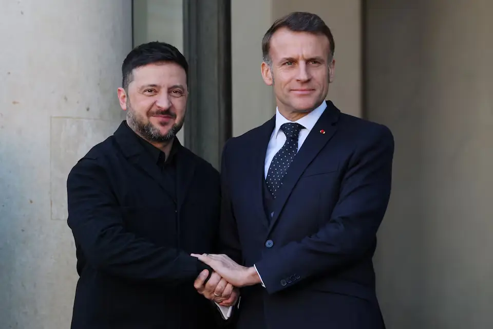 French President Emmanuel Macron shaking hands with Ukraine’s President Volodymyr Zelensky. – Reuters French President Emmanuel Macron shaking hands with Ukraine’s President Volodymyr Zelensky. – Reuters