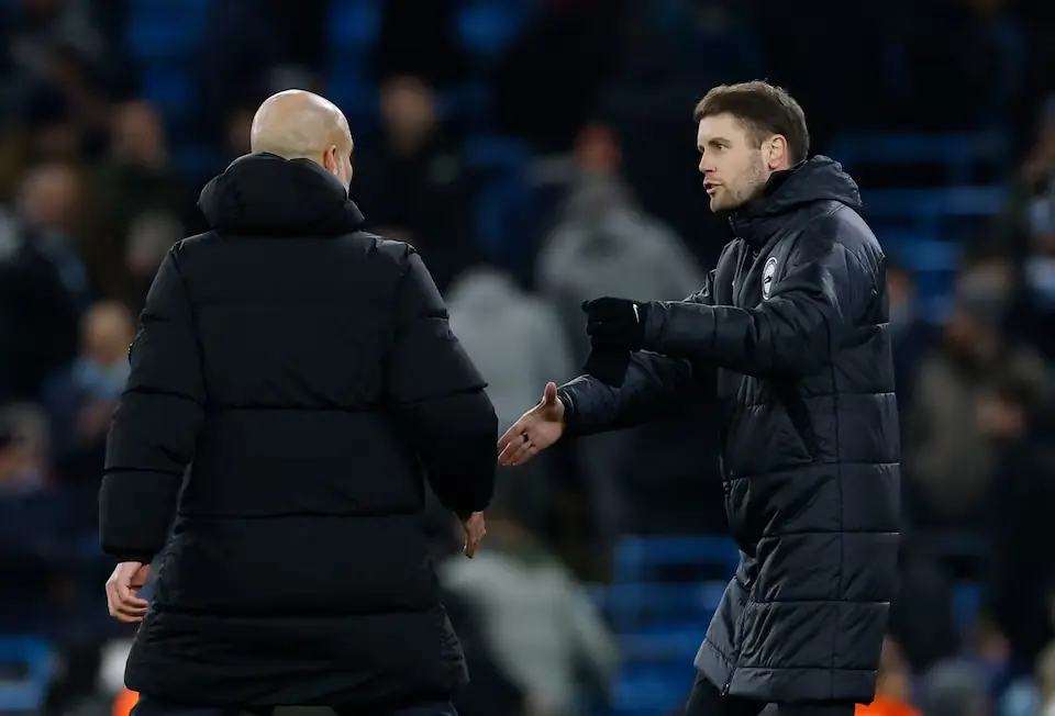Manchester City manager Pep Guardiola shakes hands with Brighton & Hove Albion manager Fabian Hurzeler. &ndash; Reuters