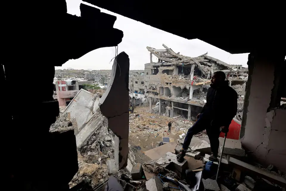 Palestinian civilians inspect the site of Thursday’s Israeli strike on a house, in the central Gaza Strip. – Reuters Palestinian civilians inspect the site of Thursday’s Israeli strike on a house, in the central Gaza Strip. – Reuters