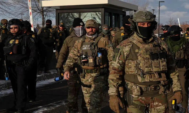 US Immigration and Customs Enforcement agents stand guard outside the Bishop Henry Whipple Federal Building during a demonstration against increased immigration enforcement in Minneapolis, Minnesota, US. &ndash; Reuters