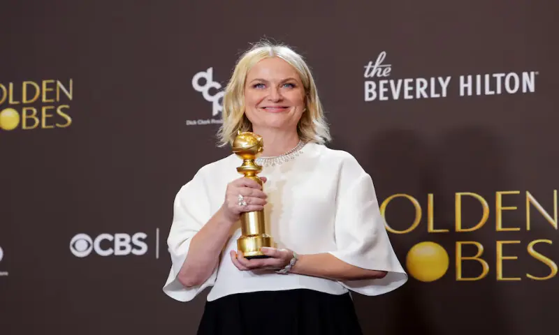 Amy Poehler poses with the Best Podcast award for &ldquo;Good Hang with Amy Poehler&rdquo; at the 83rd Annual Golden Globes in Beverly Hills, California. &ndash; Reuters