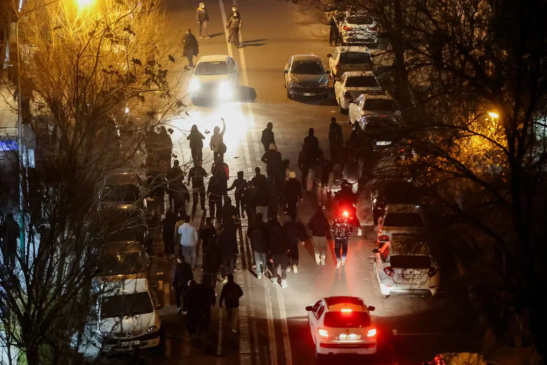 Iranian demonstrators gather in a street during a protest in Tehran. &ndash; Reuters