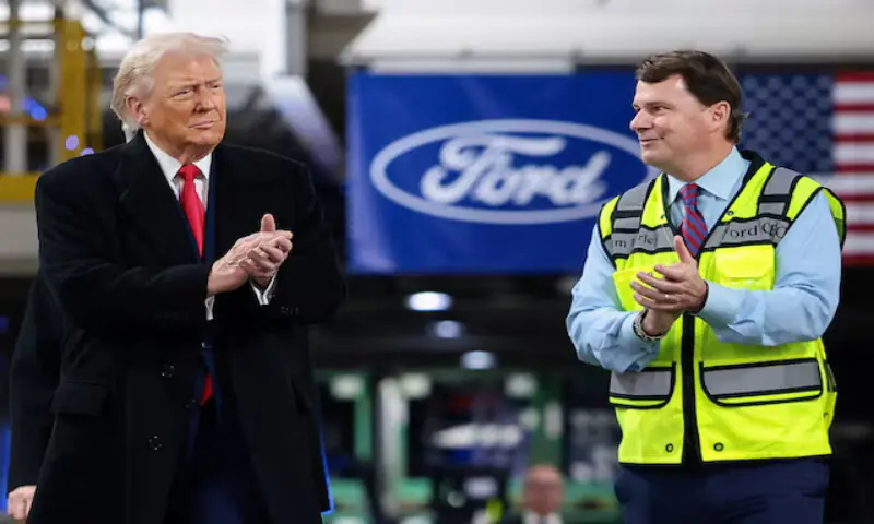 US President Donald Trump and CEO of Ford Jim Farley clap, as President Trump visits a Ford production centre in Dearborn, Michigan. &ndash; Reuters