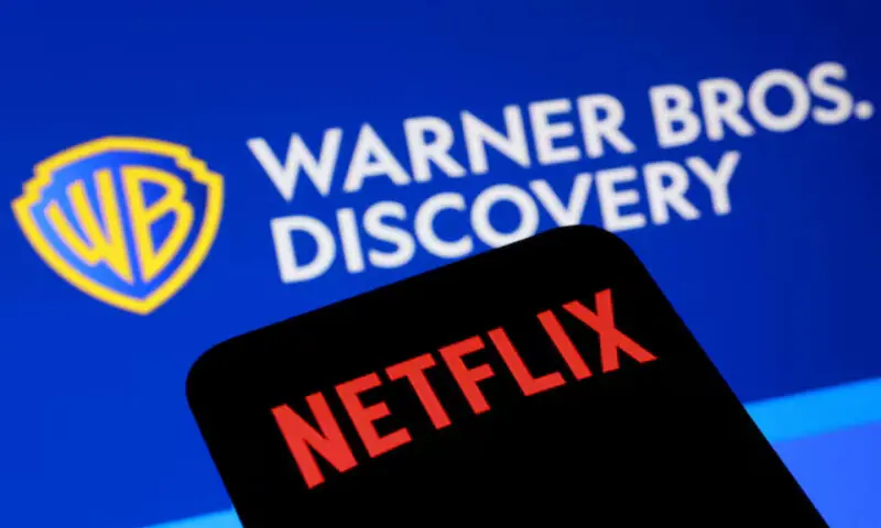 An illustration shows Netflix and Warner Bros Discovery logos. &ndash; Reuters