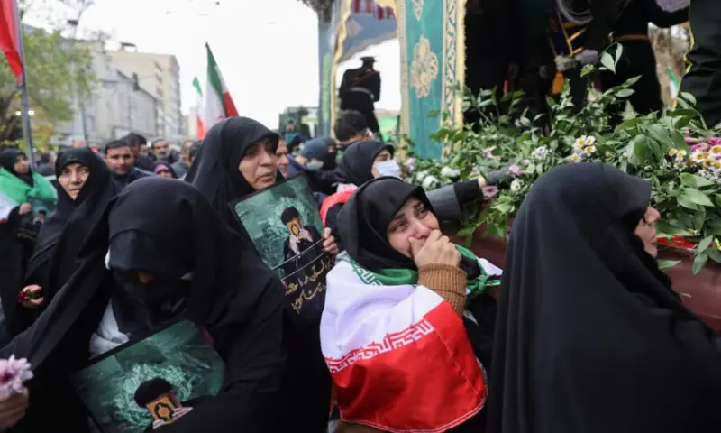 People attend the funeral of the security forces who were killed in the protests that erupted over the collapse of the currency&rsquo;s value in Tehran, Iran, on January 14, 2026. WANA via Reuters