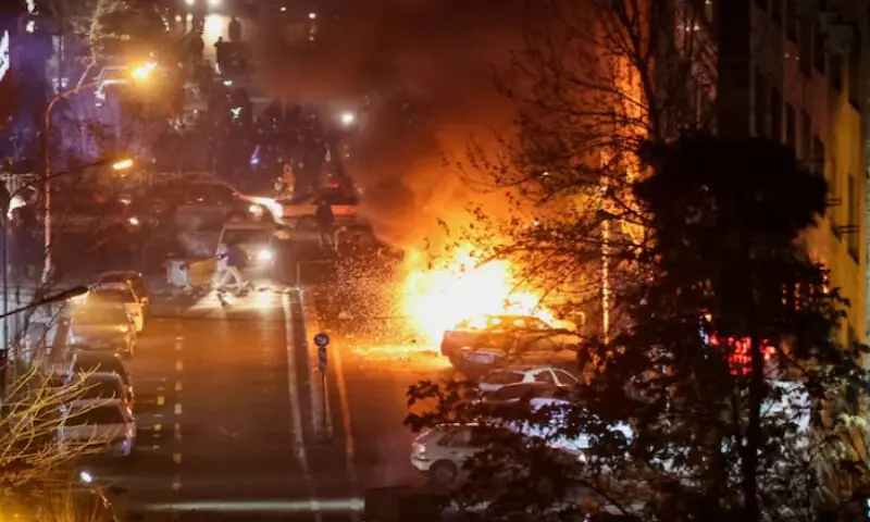 Cars burn in a street during a protest over the collapse of the currency&rsquo;s value, in Tehran, Iran, on January 8, 2026. Stringer/WANA via Reuters