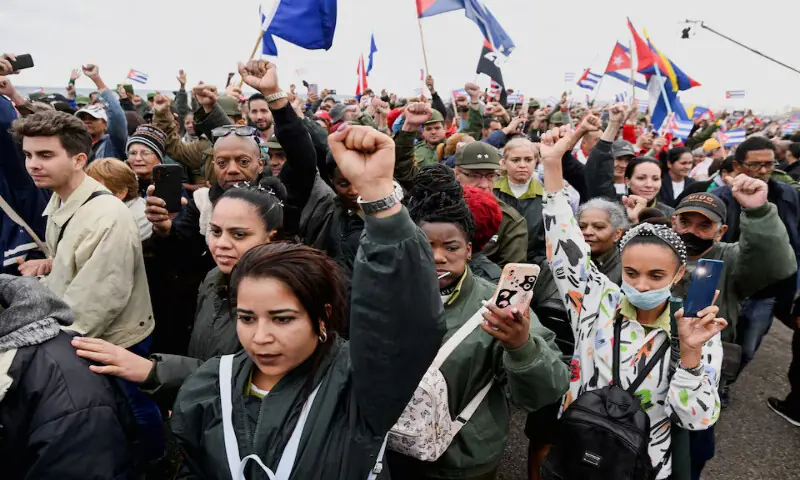 People raise their fists during a march outside the US Embassy to protest against US aggression in the region, following the capture of Venezuelan leader Nicolas Maduro and his wife, Cilia Flores, and the killing of Cuban soldiers in the U.S. strike, in Havana, Cuba, January 16, 2026. REUTERS/Norlys Perez Purchase Licensing Rights, opens new tab
