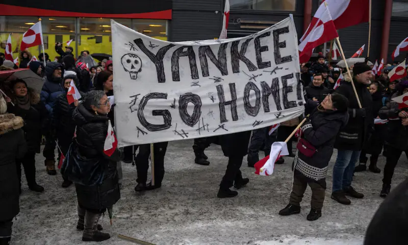 People attend a protest against US President Donald Trump&rsquo;s demand that the Arctic island be ceded to the US in Nuuk, Greenland. &ndash; Reuters