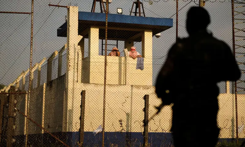 Inmates gather at a security tower at the Renovacion 1 prison in Escuintla, Guatemala. &ndash; Reuters